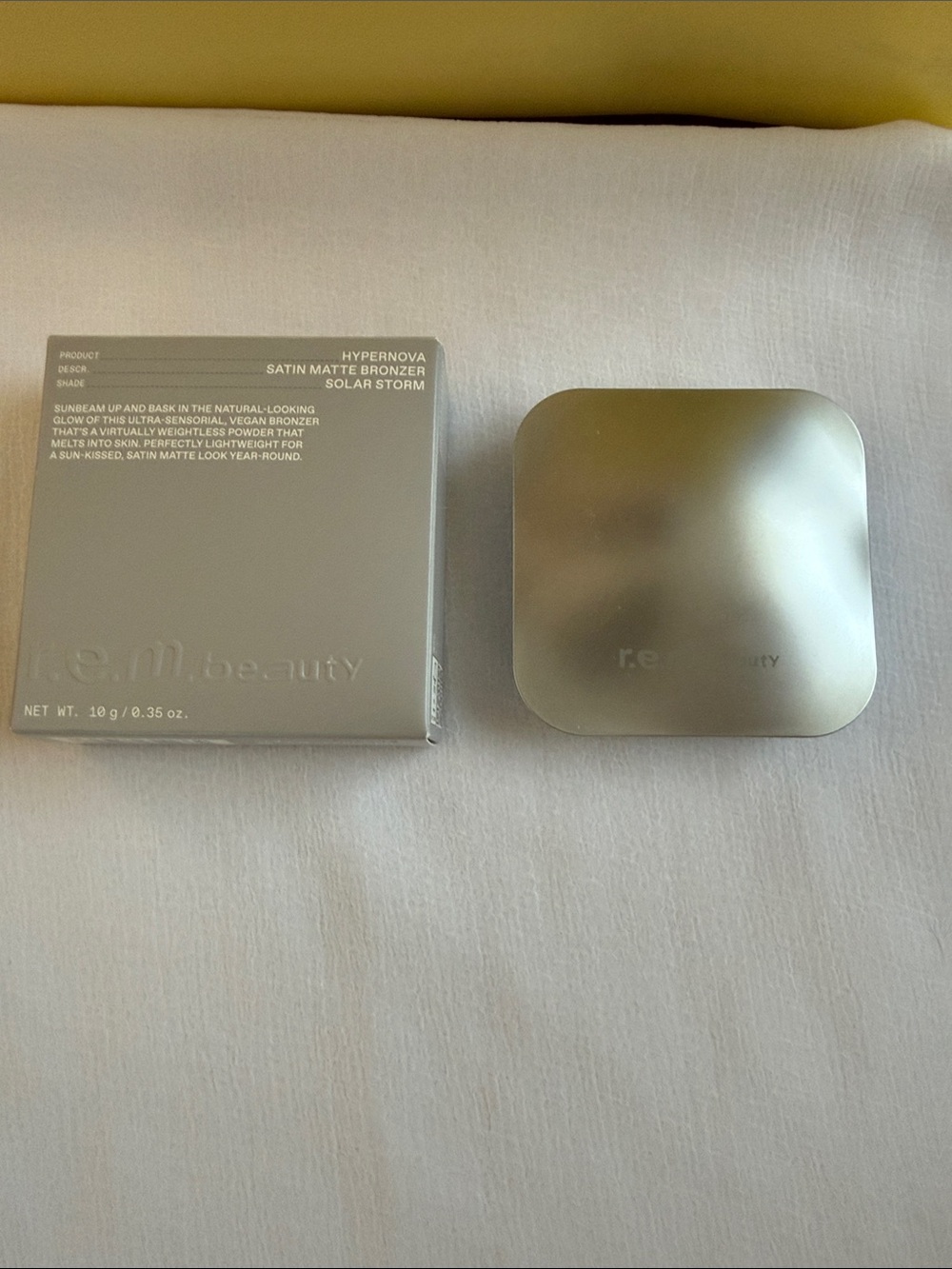 REM Beauty by Ariana Grande Satin Matte Bronzer Solar Storm - Silver Compact